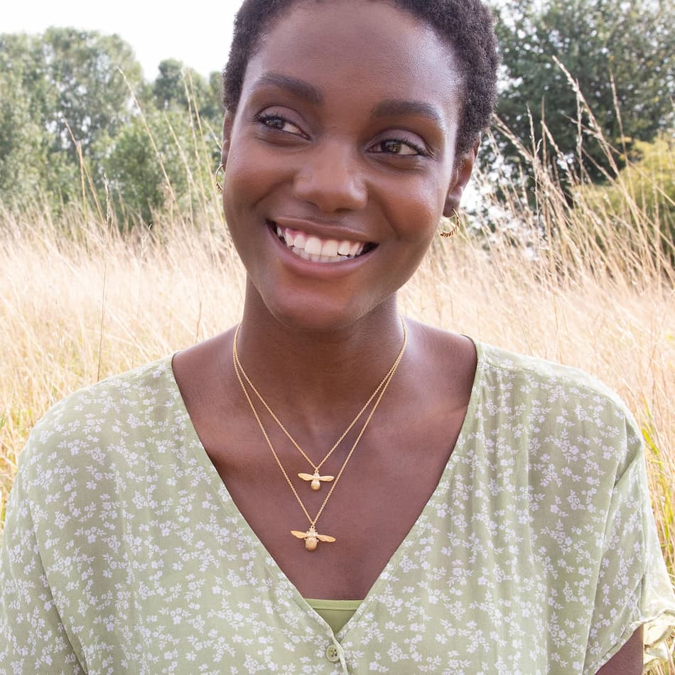 model layering two bumblebee necklaces by alex monroe jewellery