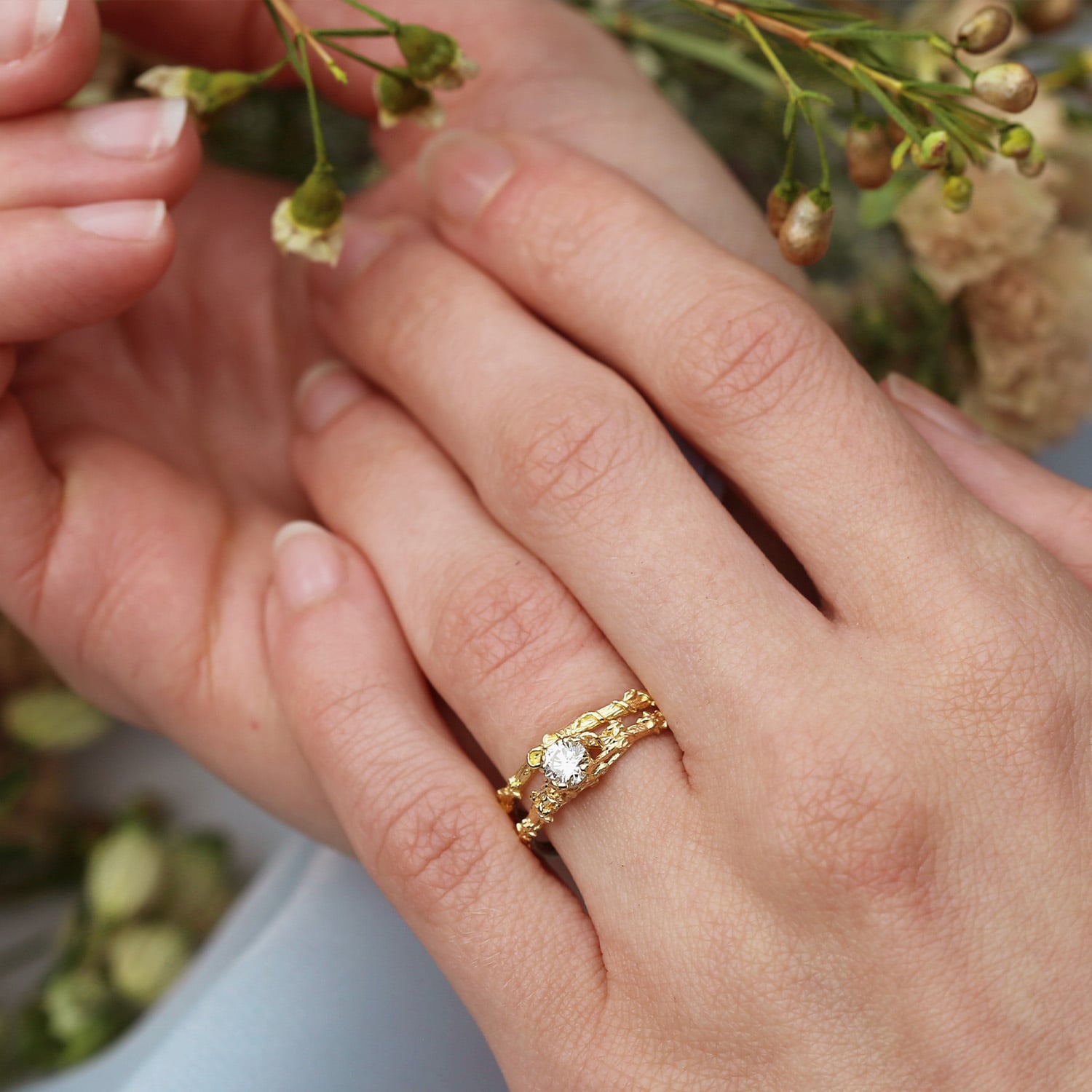Model wearing Fine Bark Ring and Fine Bark Diamond Ring by Alex Monroe Jewellery