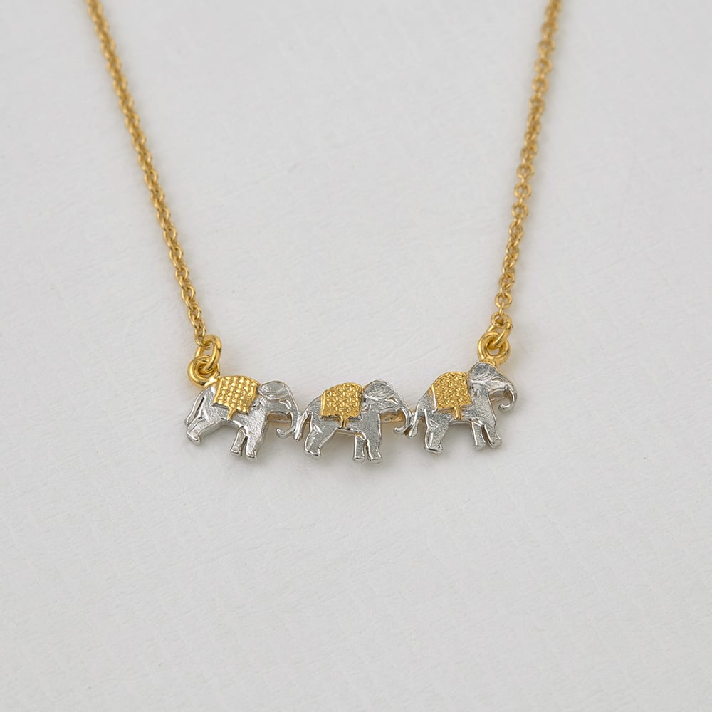 Paper shot of Marching Elephants Necklace Alex Monroe jewellery