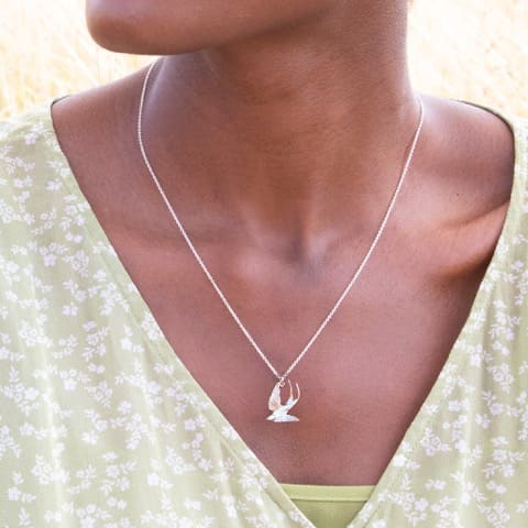model wears Swooping Swallow Necklace