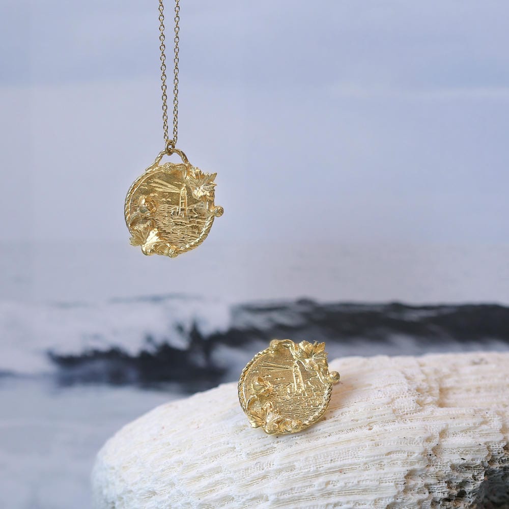 RNLI charity collaboration necklace and pin.