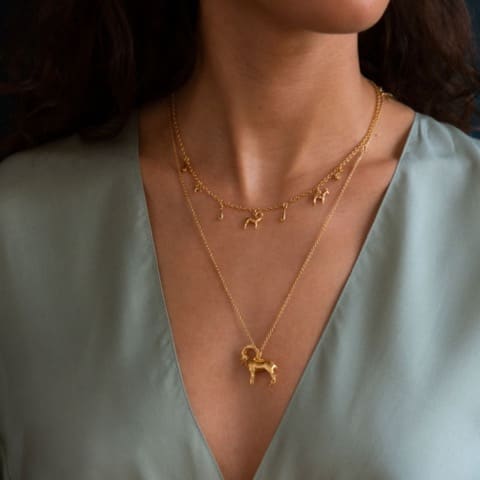 Model wears Mountain Goat Family Necklace with Ornate Drops