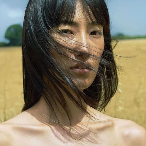 Model wears Plume Loop Necklace