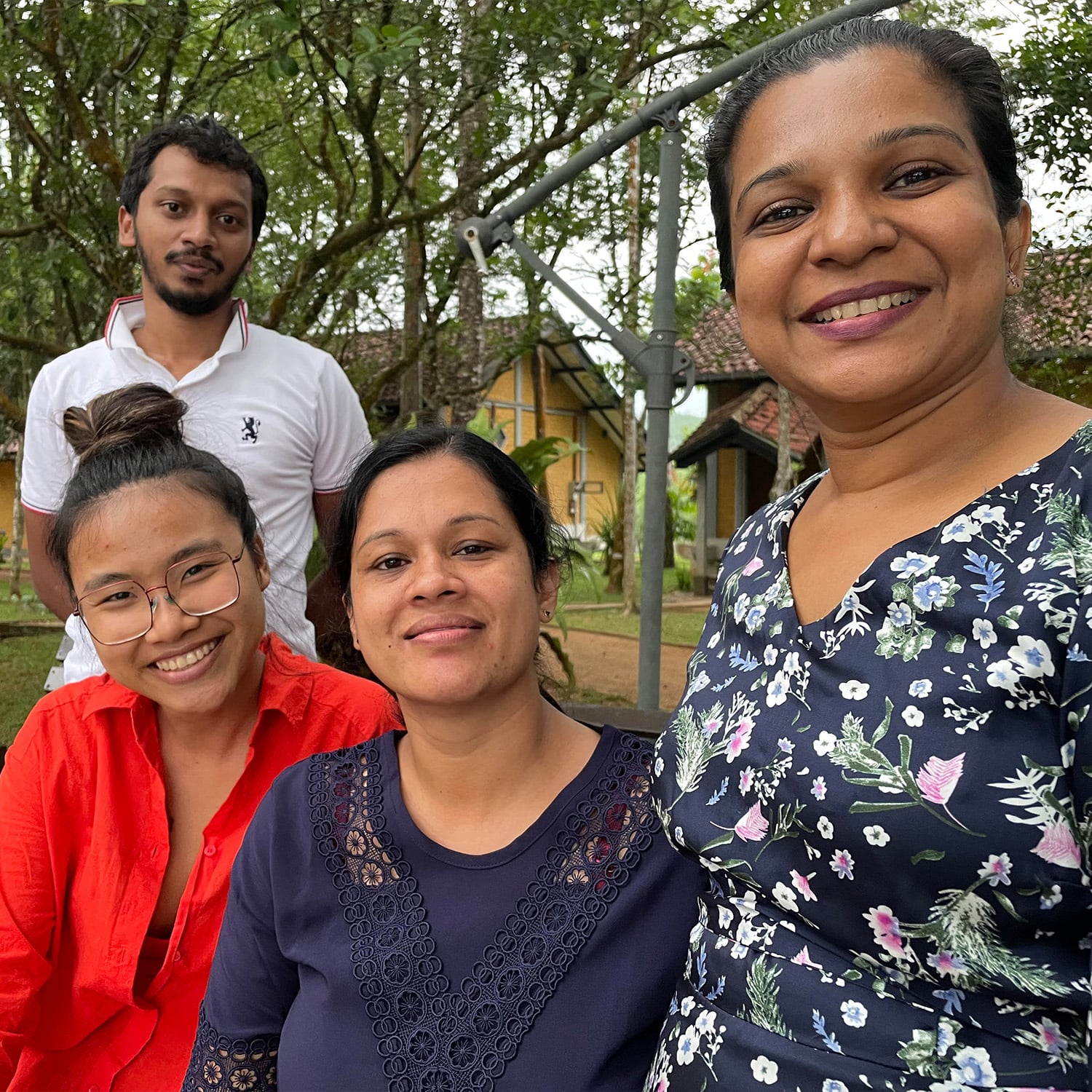 Lock and Key Necklace gold plated silver with black seed pearls displayed on vintage books with peach coloured flower