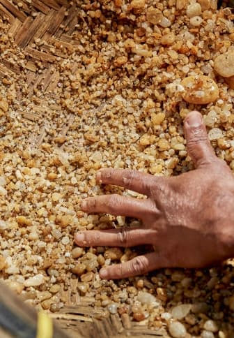 Washing gravel in a pan to search for sapphires in Sri Lanka.