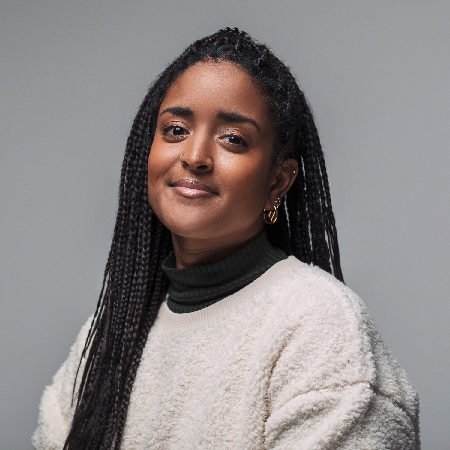 Basma Khalifa wearing a white jumper