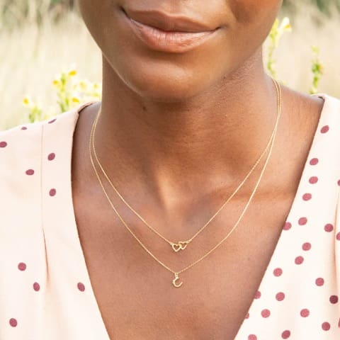 Model wears Teeny Tiny Linked Heart In-Line Necklace